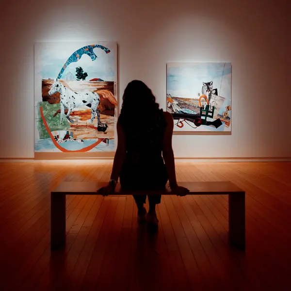 Woman Sitting In Art Museum
